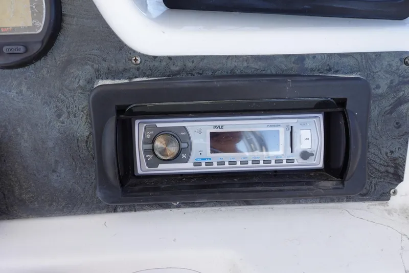 Slide: The Image of Boat dashboard with Pyle stereo system, Prosports 2250, 2004 model. - 10