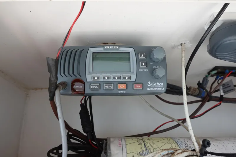 Slide: The Image of Cobra Marine radio in a 2004 Prosports 2250 boat, featuring GPS and distress functions. - 12