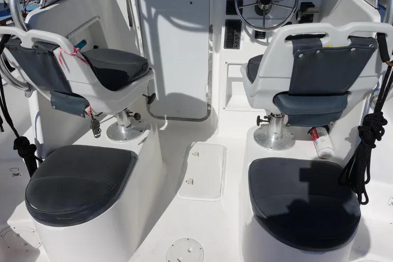 Slide: The Image of Interior of a 2004 Prosports 2250 boat with dual seating and steering wheel. - 15
