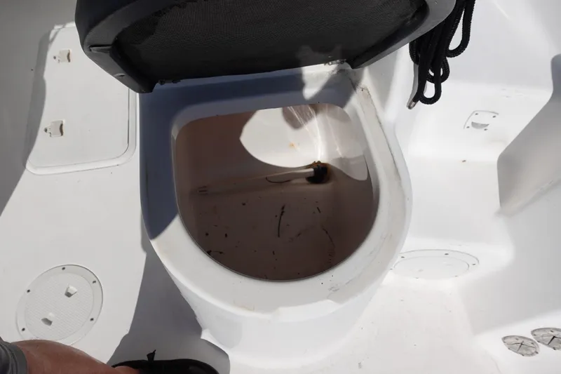 Slide: The Image of Open storage compartment on a 2004 Prosports 2250 boat, showing interior details. - 17