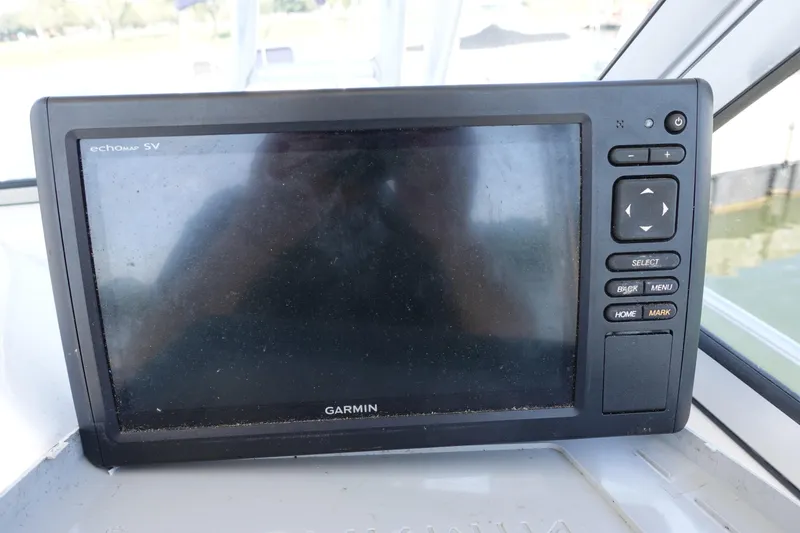Slide: The Image of Garmin echoMAP SV on 2004 Prosports 2250 boat dashboard, showing control buttons. - 9