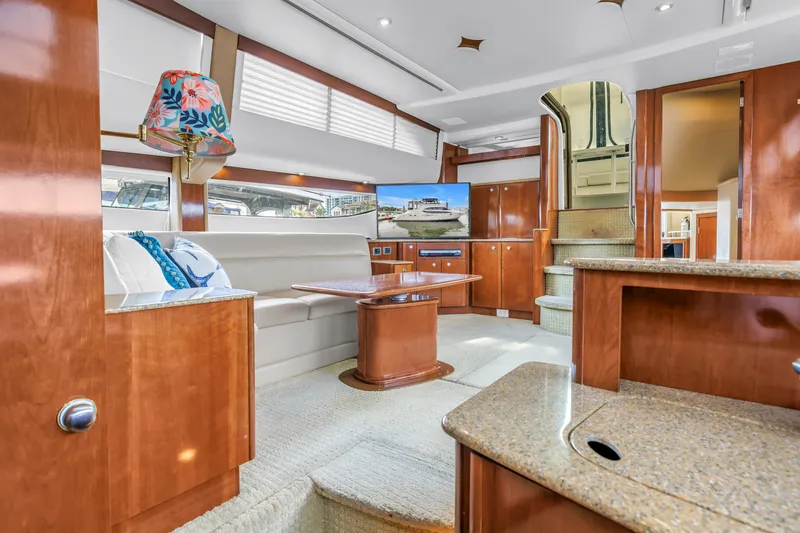 Slide: The Image of Luxurious interior of 2007 Meridian 459 Motoryacht with elegant wood finishes and modern amenities. - 18