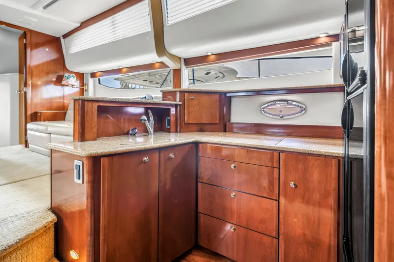 Slide: The Image of Luxurious interior of 2007 Meridian 459 Motoryacht with elegant wood cabinetry and modern amenities. - 21