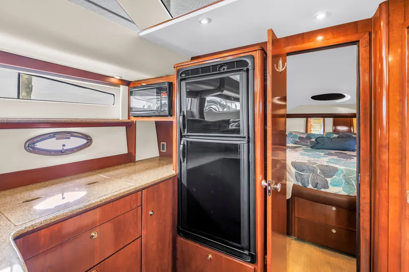 Slide: The Image of Luxurious interior of 2007 Meridian 459 Motoryacht with wood cabinetry and modern amenities. - 23