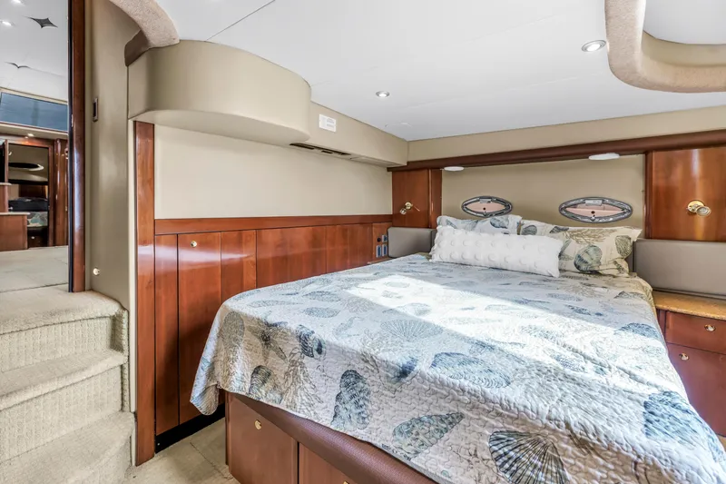 Slide: The Image of Luxurious bedroom interior of 2007 Meridian 459 Motoryacht with elegant wood finishes. - 24