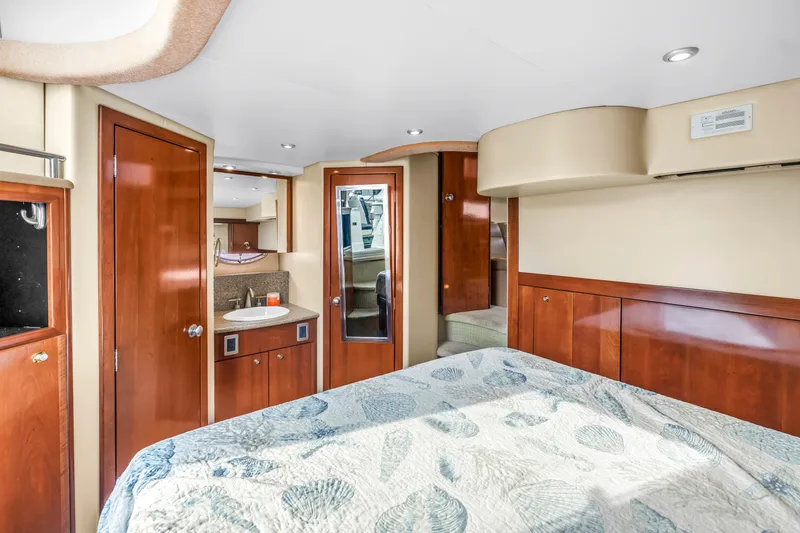 Slide: The Image of Luxurious interior of 2007 Meridian 459 Motoryacht with wood finishes and cozy bedding. - 25