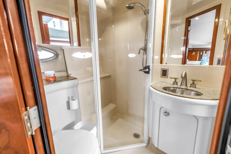 Slide: The Image of Luxurious bathroom in 2007 Meridian 459 Motoryacht with shower, sink, and toilet. - 27
