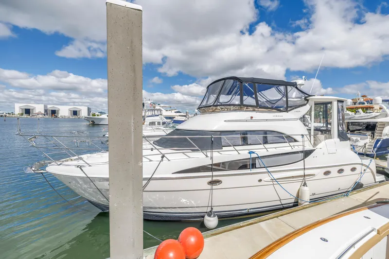Slide: The Image of 2008 Meridian 459 Motoryacht docked at marina under blue sky. - 3