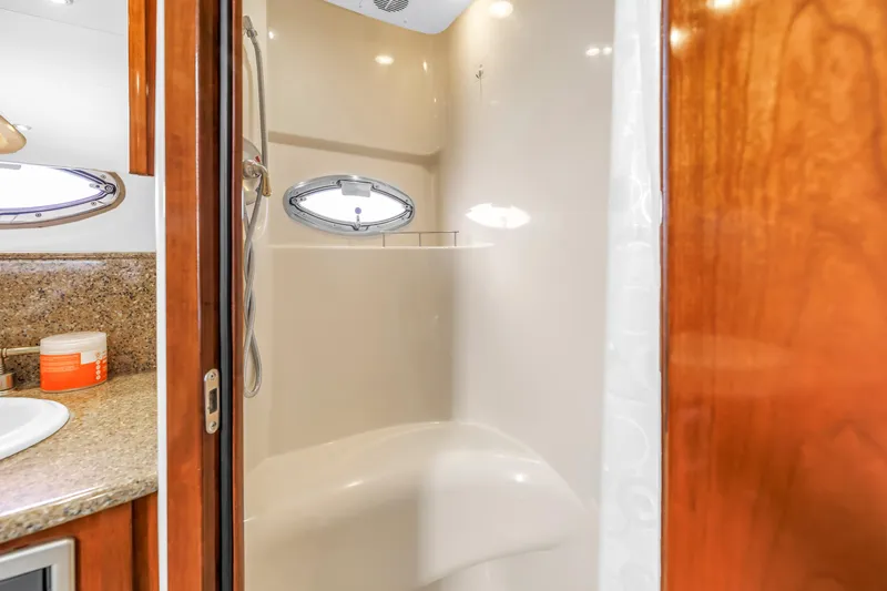 Slide: The Image of Shower area in 2007 Meridian 459 Motoryacht with porthole and granite countertop. - 36