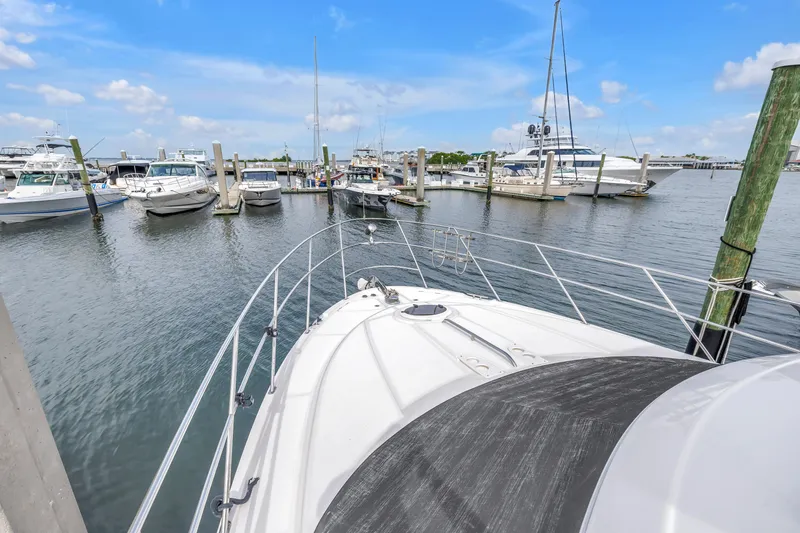 Slide: The Image of 2007 Meridian 459 Motoryacht docked in a marina with other boats. - 37