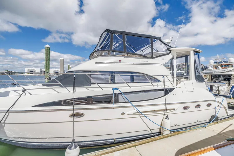 Slide: The Image of 2008 Meridian 459 Motoryacht docked under a clear blue sky. - 4