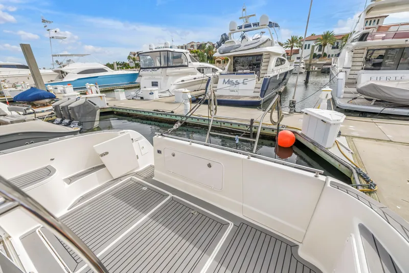 Slide: The Image of 2007 Meridian 459 Motoryacht docked at marina with other luxury boats. - 41