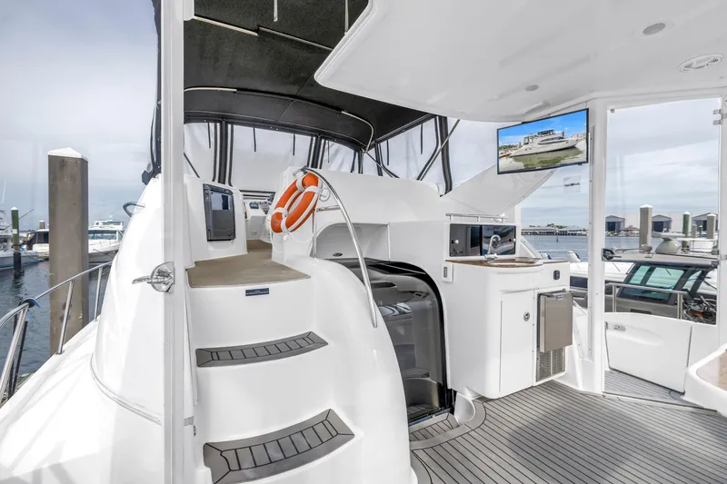 Slide: The Image of 2007 Meridian 459 Motoryacht interior with modern amenities and marina view. - 43