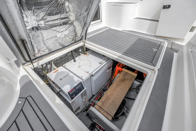 Slide: The Image of Open engine compartment of 2007 Meridian 459 Motoryacht, showcasing Onan marine generator. - 44