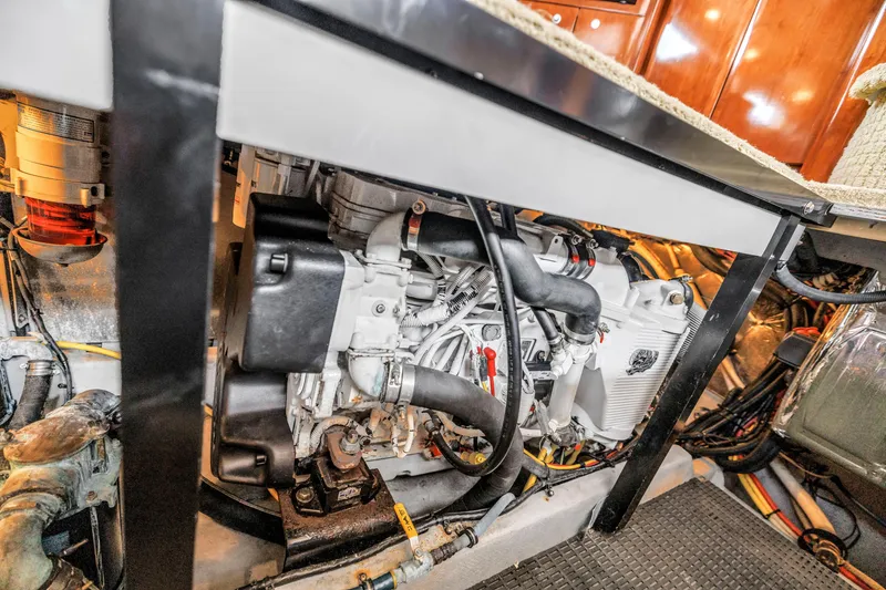Slide: The Image of Engine room of 2007 Meridian 459 Motoryacht, showcasing detailed mechanical components. - 46