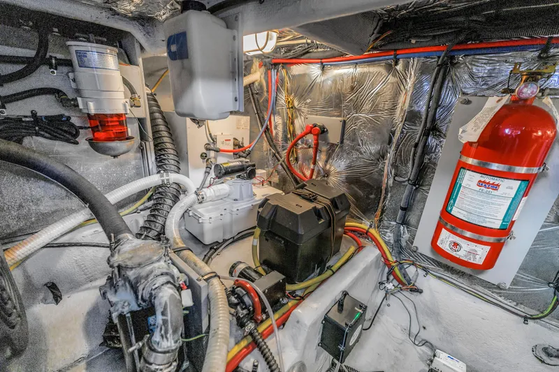 Slide: The Image of Engine room of 2007 Meridian 459 Motoryacht with fire extinguisher and wiring. - 47