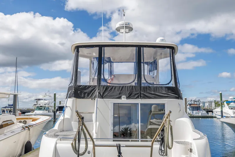 Slide: The Image of 2008 Meridian 459 Motoryacht docked at marina under blue sky. - 6