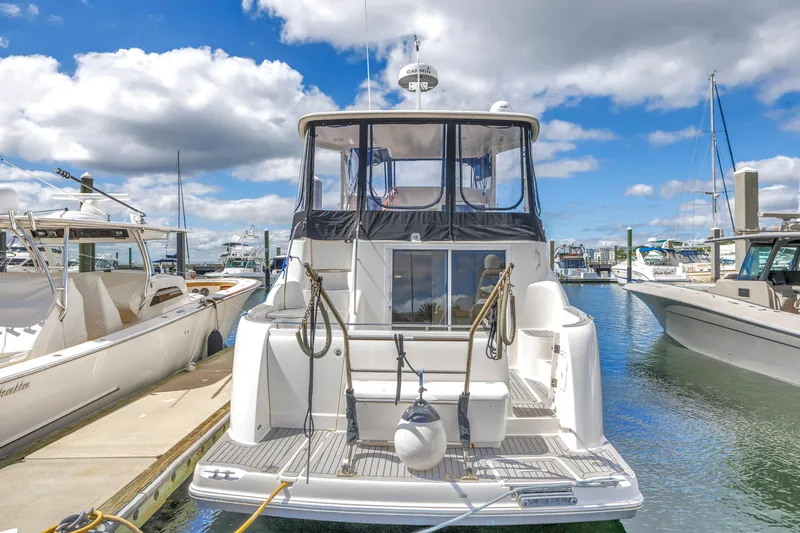 Slide: The Image of 2008 Meridian 459 Motoryacht docked at marina under blue sky. - 7