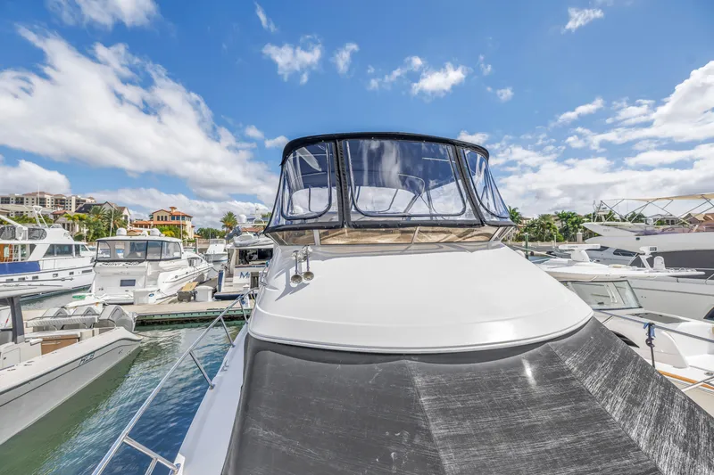 Slide: The Image of 2008 Meridian 459 Motoryacht docked at marina under blue sky. - 8