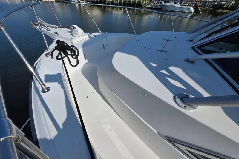 Slide: The Image of 1992 Grady-White Sailfish 25 Sportbridge boat deck with railing and anchor. - 14