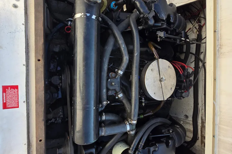 Slide: The Image of Engine compartment of a 1992 Grady-White Sailfish 25 Sportbridge boat. - 36
