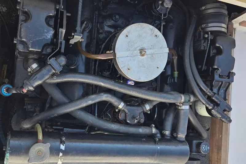 Slide: The Image of Engine of a 1992 Grady-White Sailfish 25 Sportbridge boat, showcasing intricate components. - 37