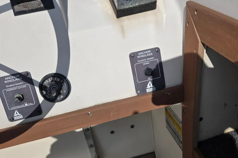 Slide: The Image of 1992 Grady-White Sailfish 25 Sportbridge anchor windlass controls on boat dashboard. - 38