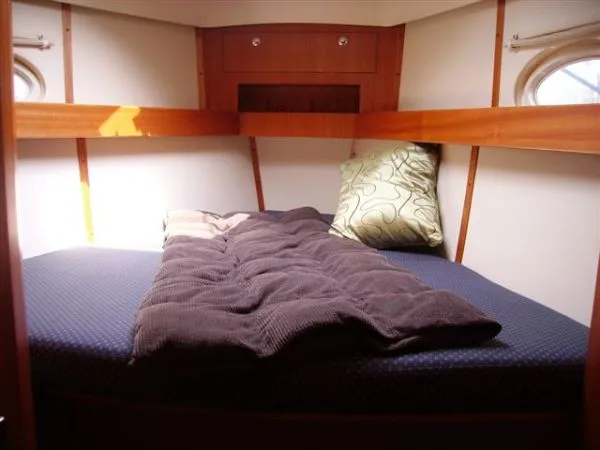 Slide: The Image of Cozy cabin bed in 2007 Elan Impression 434 yacht with wooden interior. - 3