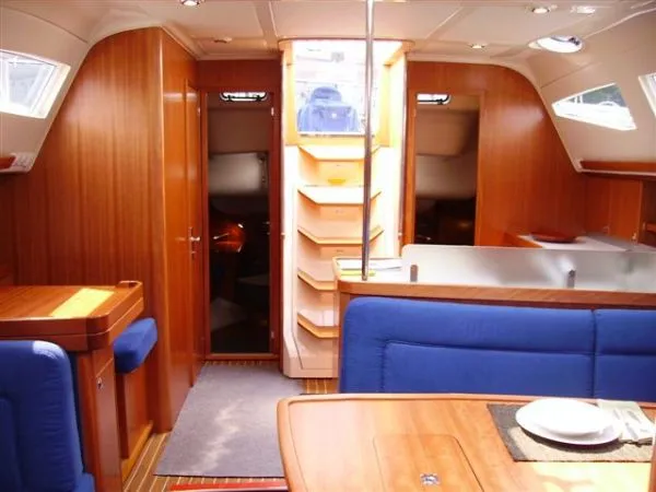 Slide: The Image of Interior of 2007 Elan Impression 434 yacht with wooden finish and blue seating. - 4