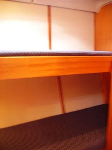 Slide: The Image of Interior cabin of 2007 Elan Impression 434 yacht with wooden bunk beds. - 5