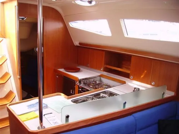 Slide: The Image of Interior of 2007 Elan Impression 434 yacht with modern kitchen and wooden cabinetry. - 7