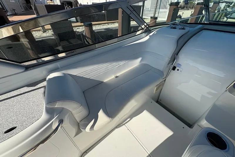 Slide: The Image of 2004 Formula 330 Sun Sport boat interior with white seating and sleek design. - 10