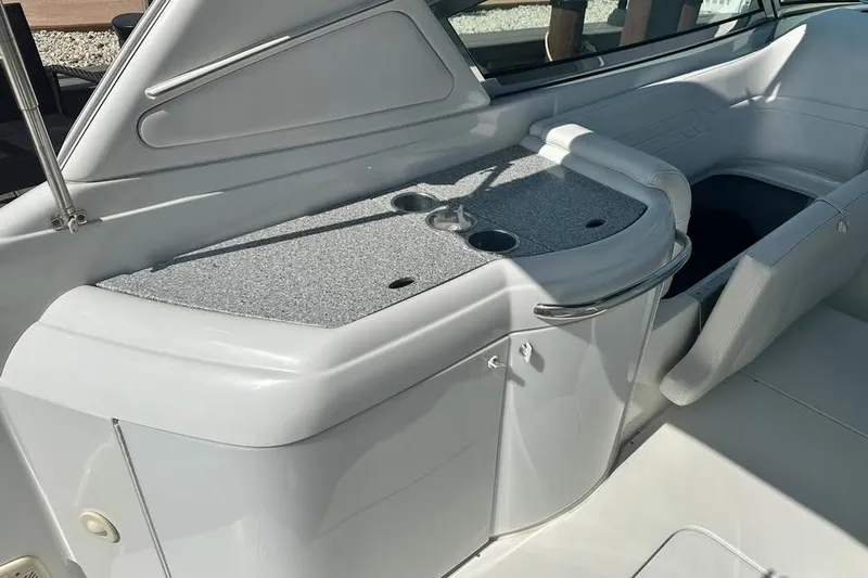 Slide: The Image of 2004 Formula 330 Sun Sport boat interior with seating and storage area. - 13