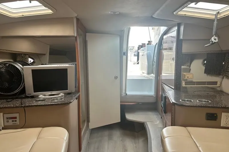 Slide: The Image of Interior of 2004 Formula 330 Sun Sport boat with modern amenities and seating. - 18