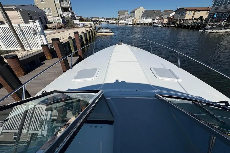 Slide: The Image of 2004 Formula 330 Sun Sport boat docked in a residential canal. - 23