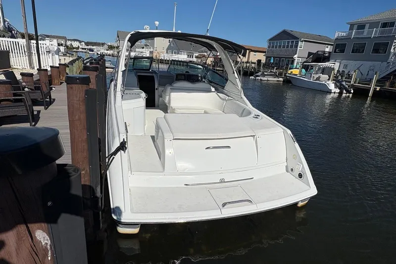 Slide: The Image of 2004 Formula 330 Sun Sport boat docked in a residential marina. - 24