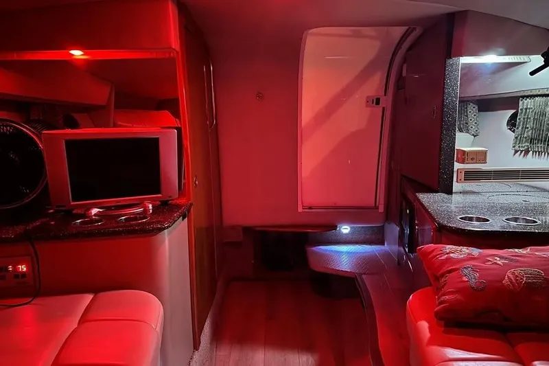 Slide: The Image of Interior of a 2004 Formula 330 Sun Sport boat with red ambient lighting. - 26