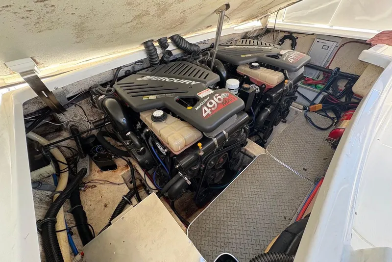 Slide: The Image of 2004 Formula 330 Sun Sport engine compartment with twin Mercury 496 MAG engines. - 30