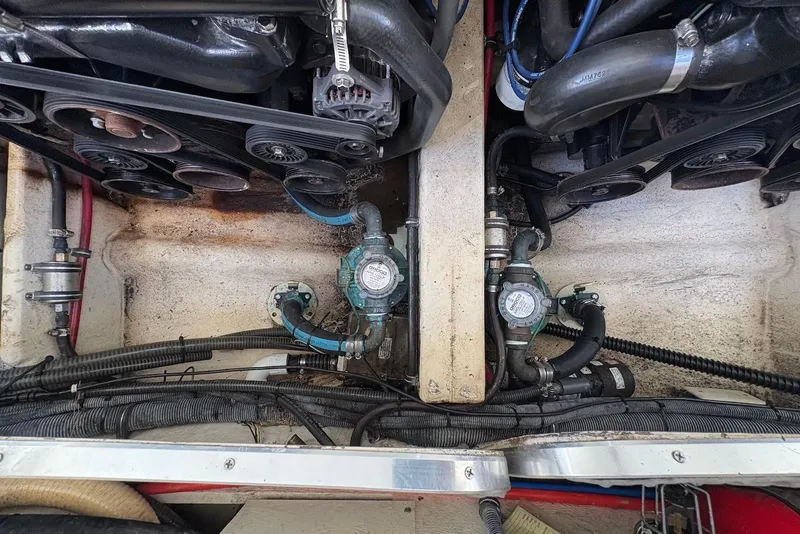 Slide: The Image of Engine compartment of a 2004 Formula 330 Sun Sport boat, showing belts and hoses. - 31