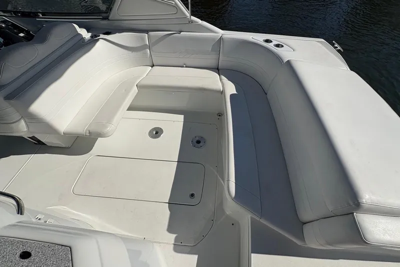 Slide: The Image of 2004 Formula 330 Sun Sport boat interior with white seating and deck. - 9