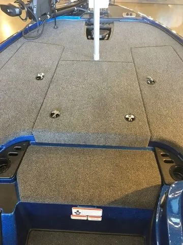 Slide: The Image of 2026 Nitro Z18 boat deck with gray carpet and blue trim. - 13
