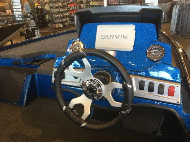 Slide: The Image of Nitro Z18 2026 boat console with Garmin display and steering wheel. - 3