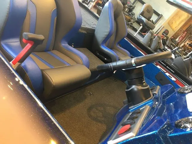 Slide: The Image of Interior of a 2026 Nitro Z18 boat with blue seats. - 4