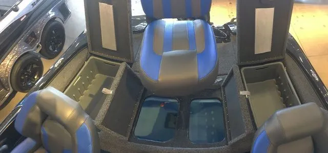 Slide: The Image of Interior of Nitro Z18 boat, 2026 model, featuring blue seats. - 8