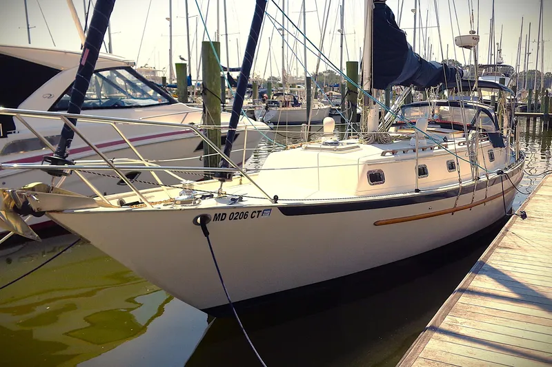 Slide: The Image of 1995 Pacific Seacraft 37 sailboat docked at marina, side view. - 13