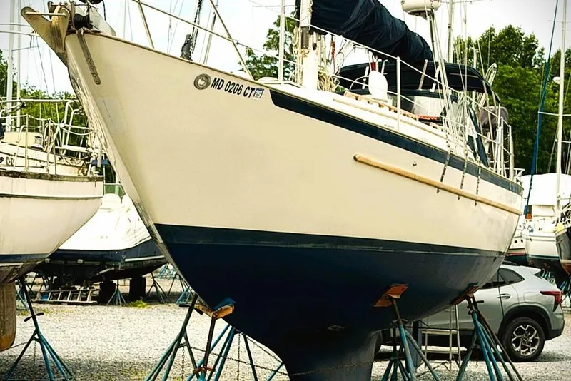 Slide: The Image of 1995 Pacific Seacraft 37 sailboat on stands in a boatyard, ready for maintenance. - 15