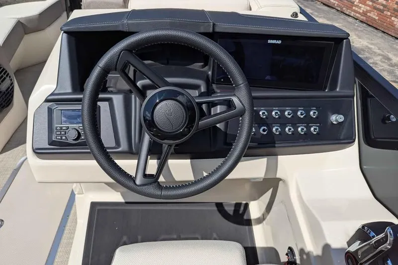Slide: The Image of Steering console of 2026 Alera M23L boat with modern controls and display. - 13