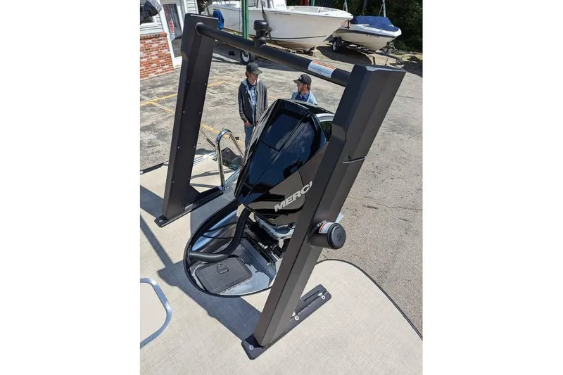 Slide: The Image of 2026 Alera M23L boat with sleek black motor and sturdy frame in outdoor setting. - 15