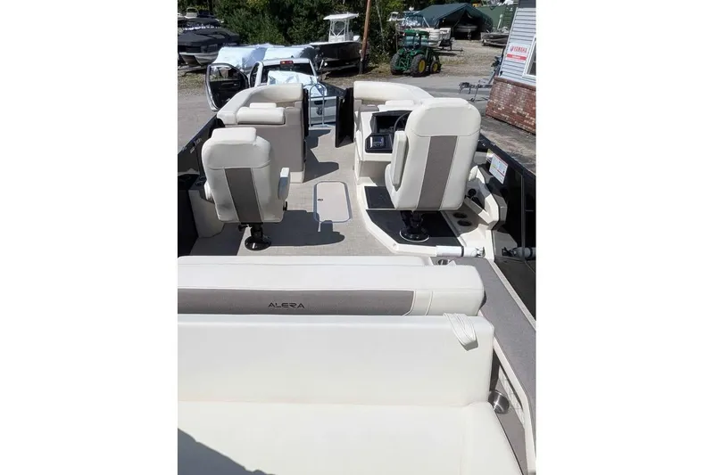 Slide: The Image of Interior view of 2026 Alera M23L boat with white seating and modern design. - 7