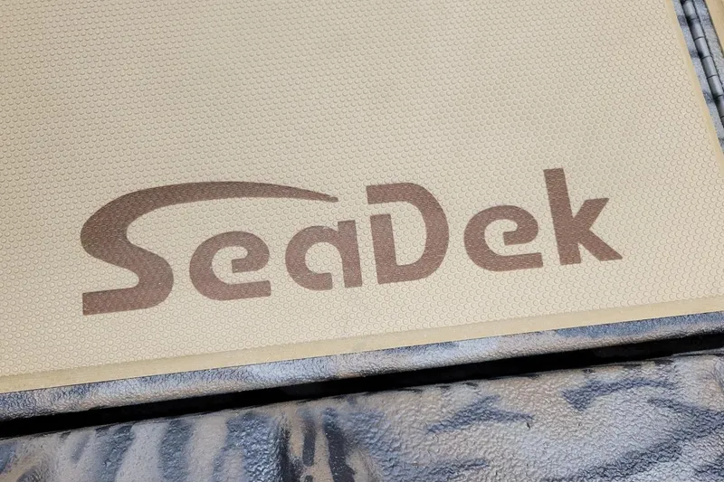 Slide: The Image of SeaDek logo on Xpress H20C Crappie boat, 2026 model, featuring textured surface. - 6